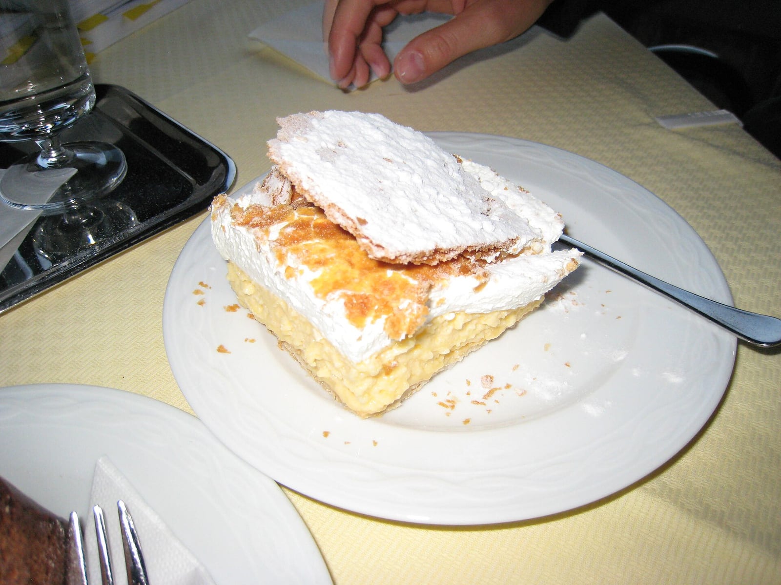A slice of Bled cream cake with layers of pastry, custard and cream